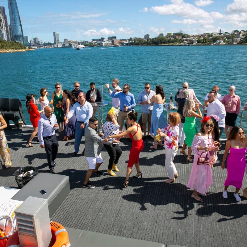 a group of people on a beach posing for the camera