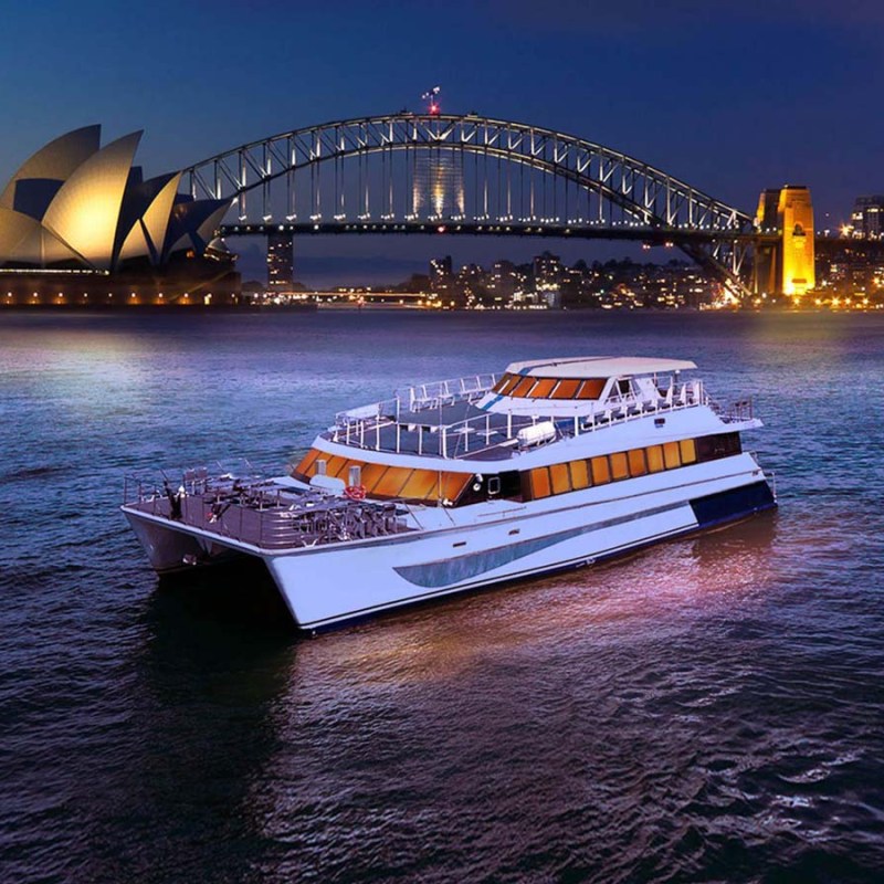 a boat on a body of water with a city in the background