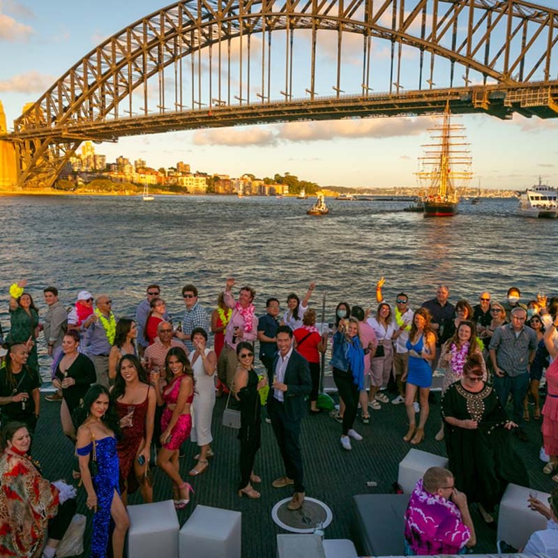a group of people crossing a bridge over water
